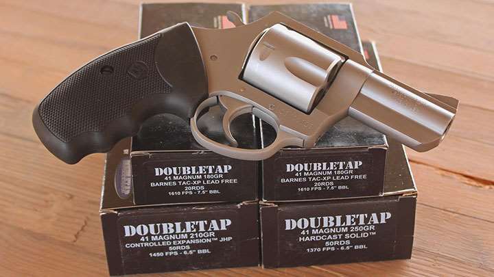 Charter Arms Pug stainless steel revolver on doubletap ammunition boxes