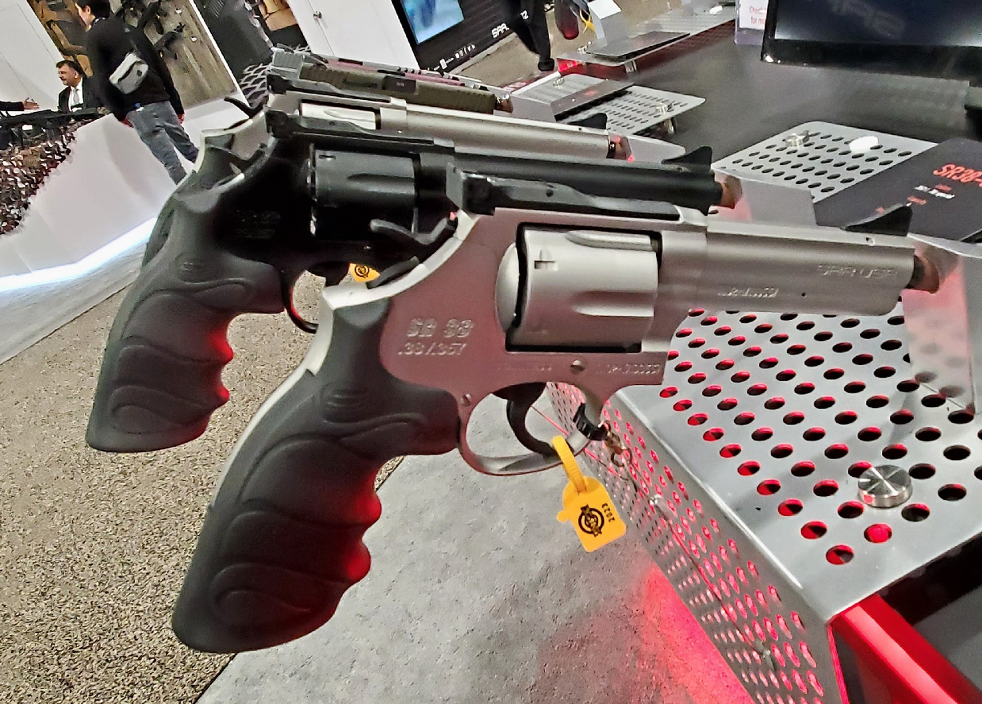 SAR USA SR-38 revolver optic-ready double-action wheelgun shown with other guns in background at tradeshow