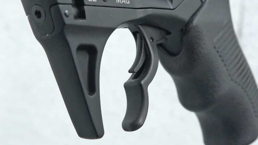 black revolver trigger and grip white background