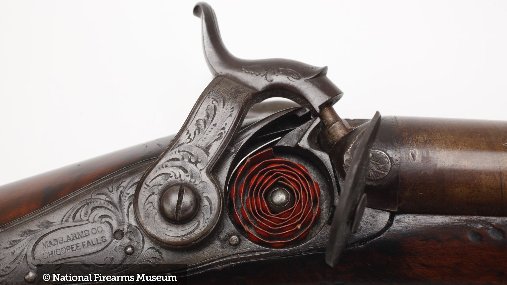 Maynard tape primer retrofit into springfield action making a double-barrel shotgun with damascus twist barrels