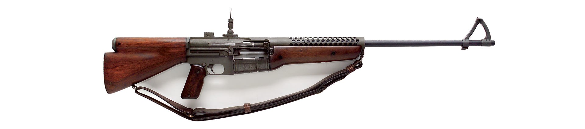 Johnson Auto carbine on white rifle gun sling wood steel