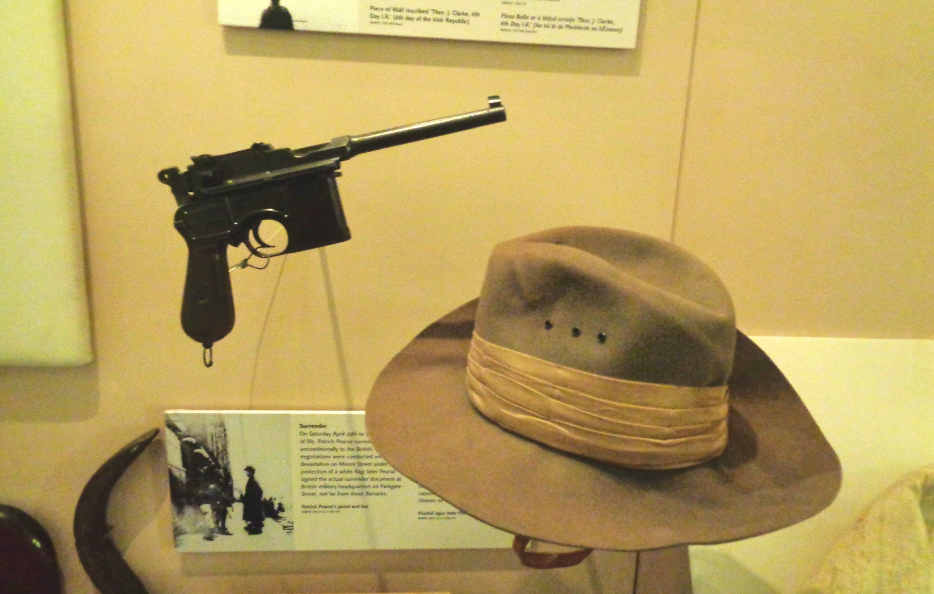 broomhandle mauser shown on display with hat