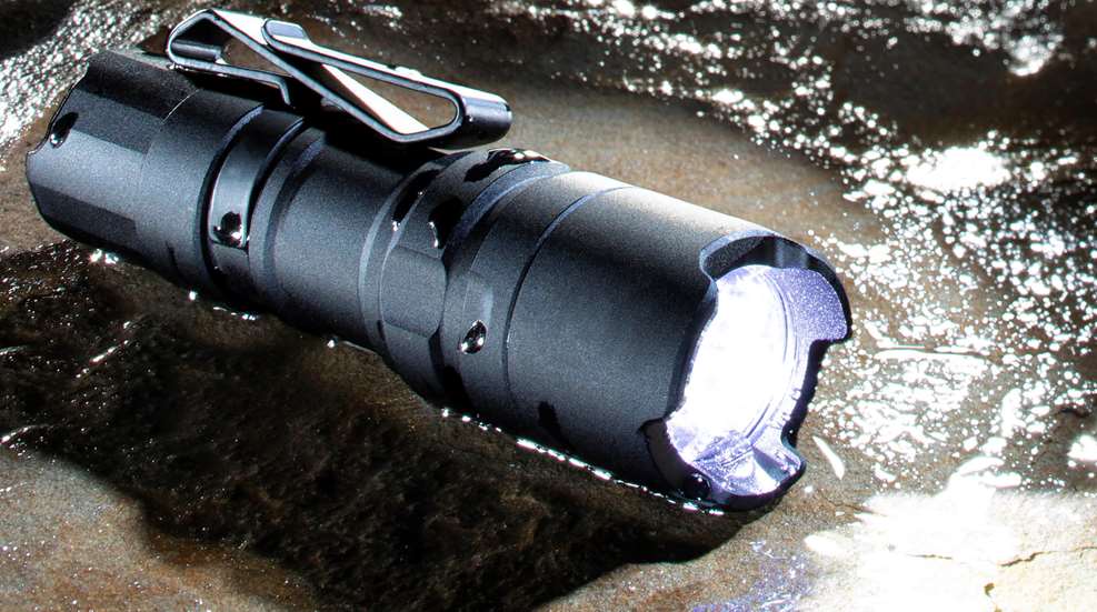 LED Flashlight beam on wet rock 