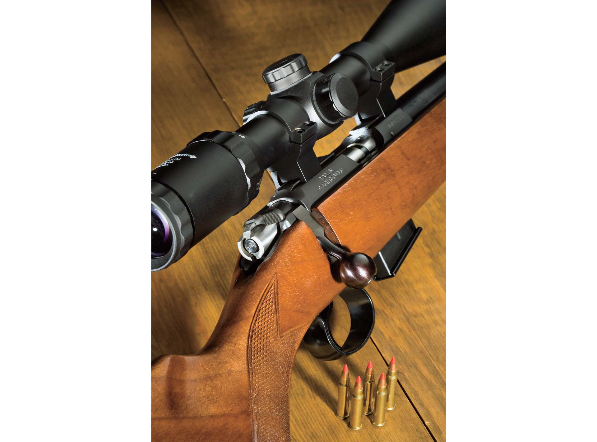 CZ452 bolt-action rifle on table with ammunition