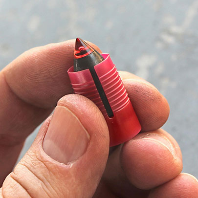 Muzzleloader bullet in hand fingers closeup