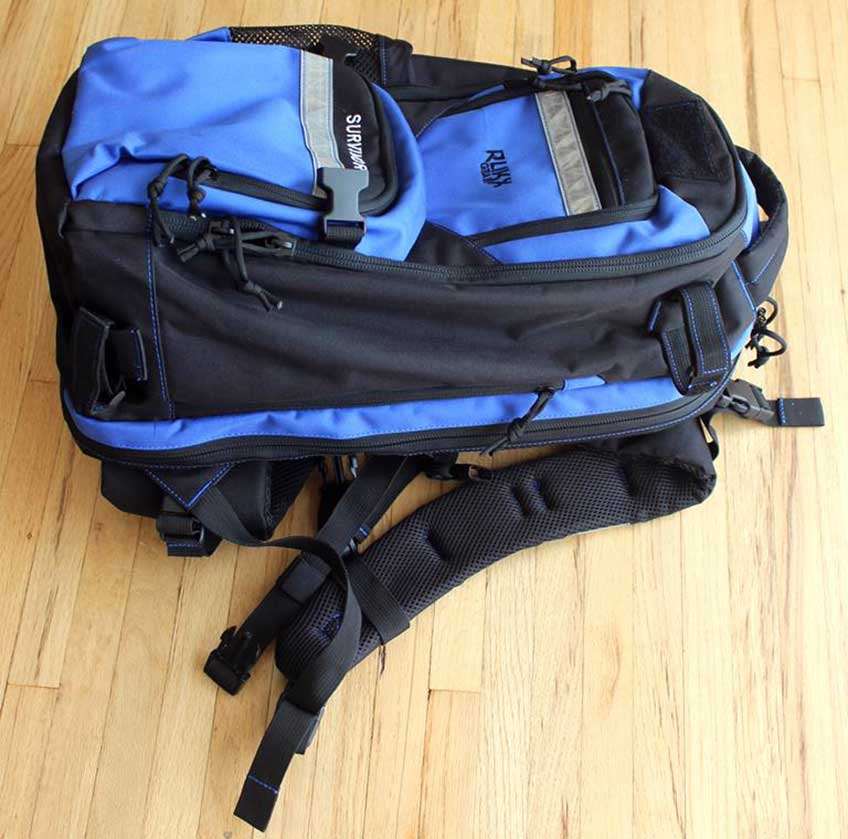 black blue backpack on wooden floor