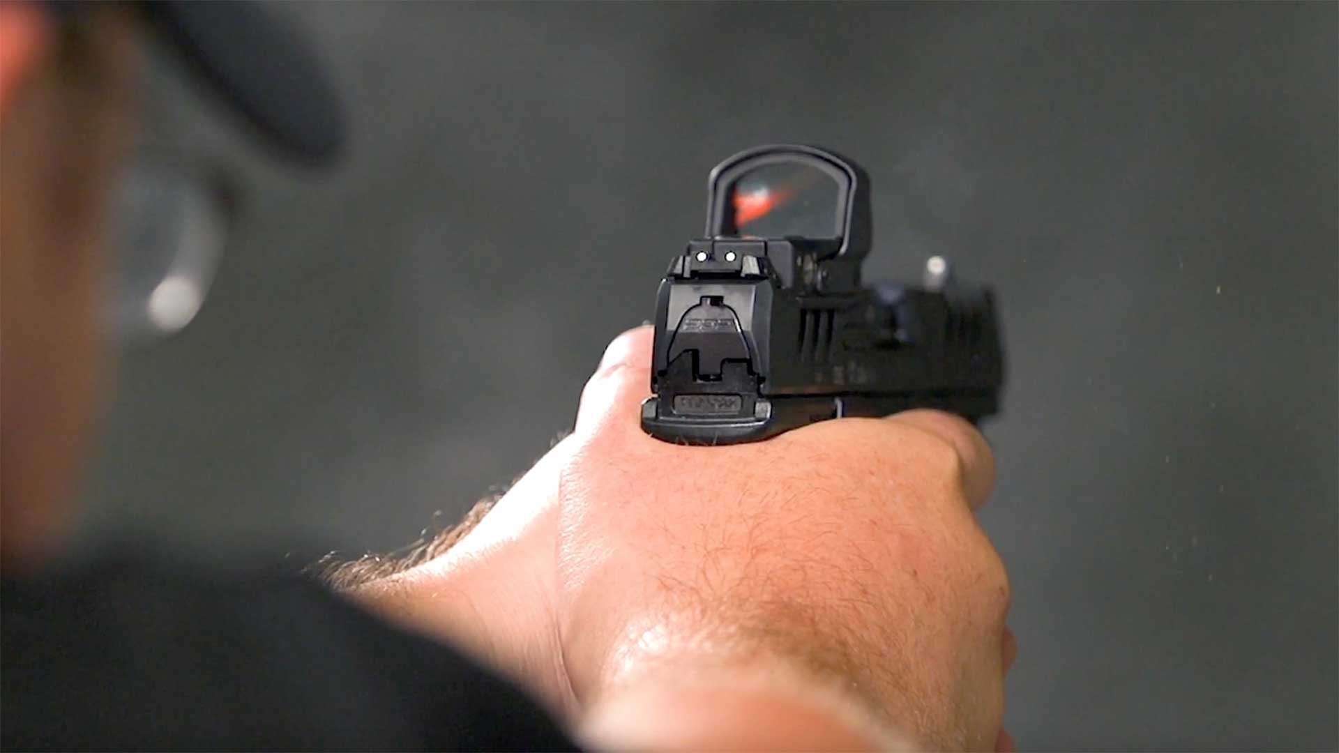 Man shooting the Walther PDP Compact pistol.