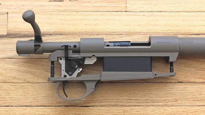 A close-up side view of the assembled Howa 1500 action.