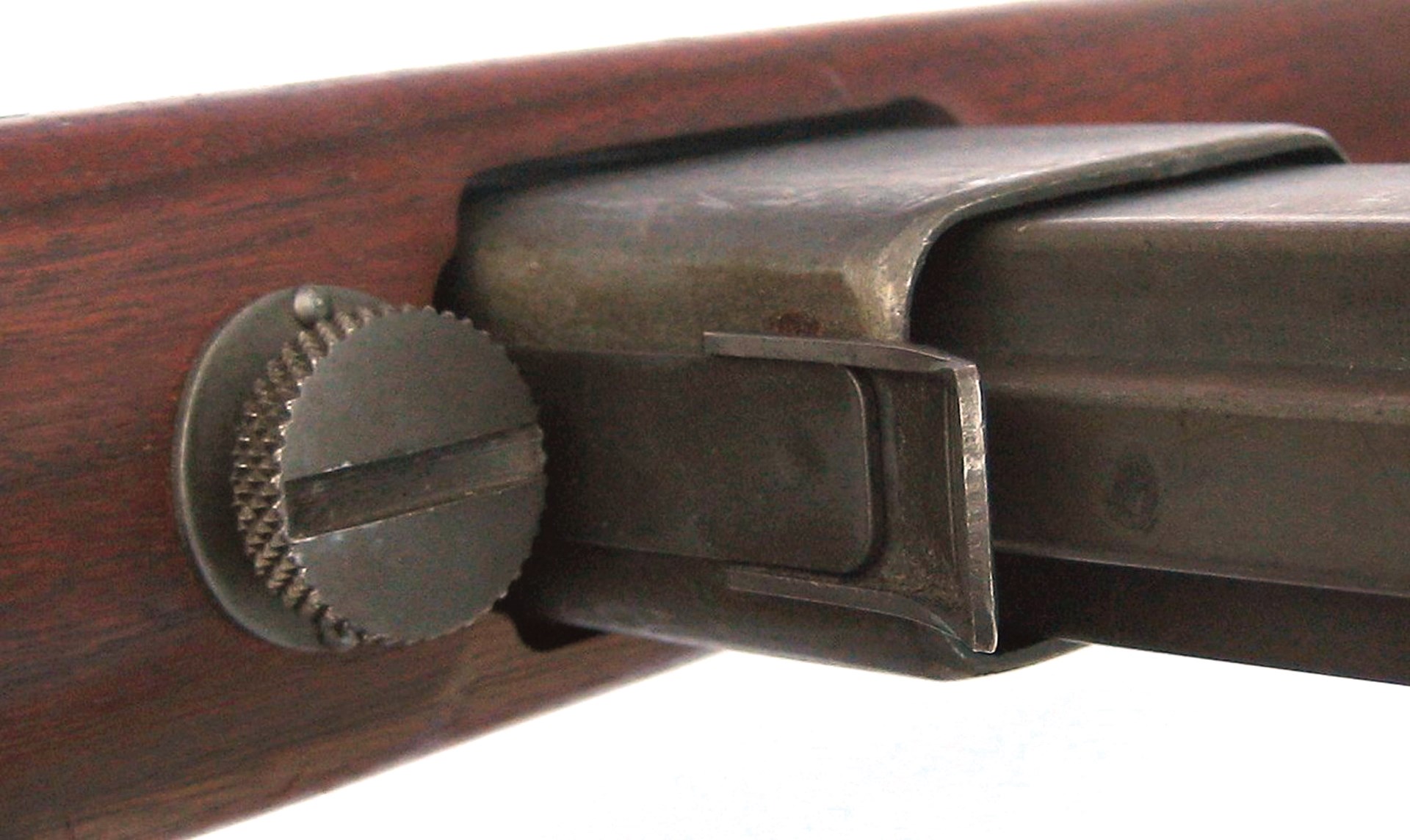 The Reising’s stock could be quickly separated from the barreled-action by turning out a thumbscrew located behind the magazine well.