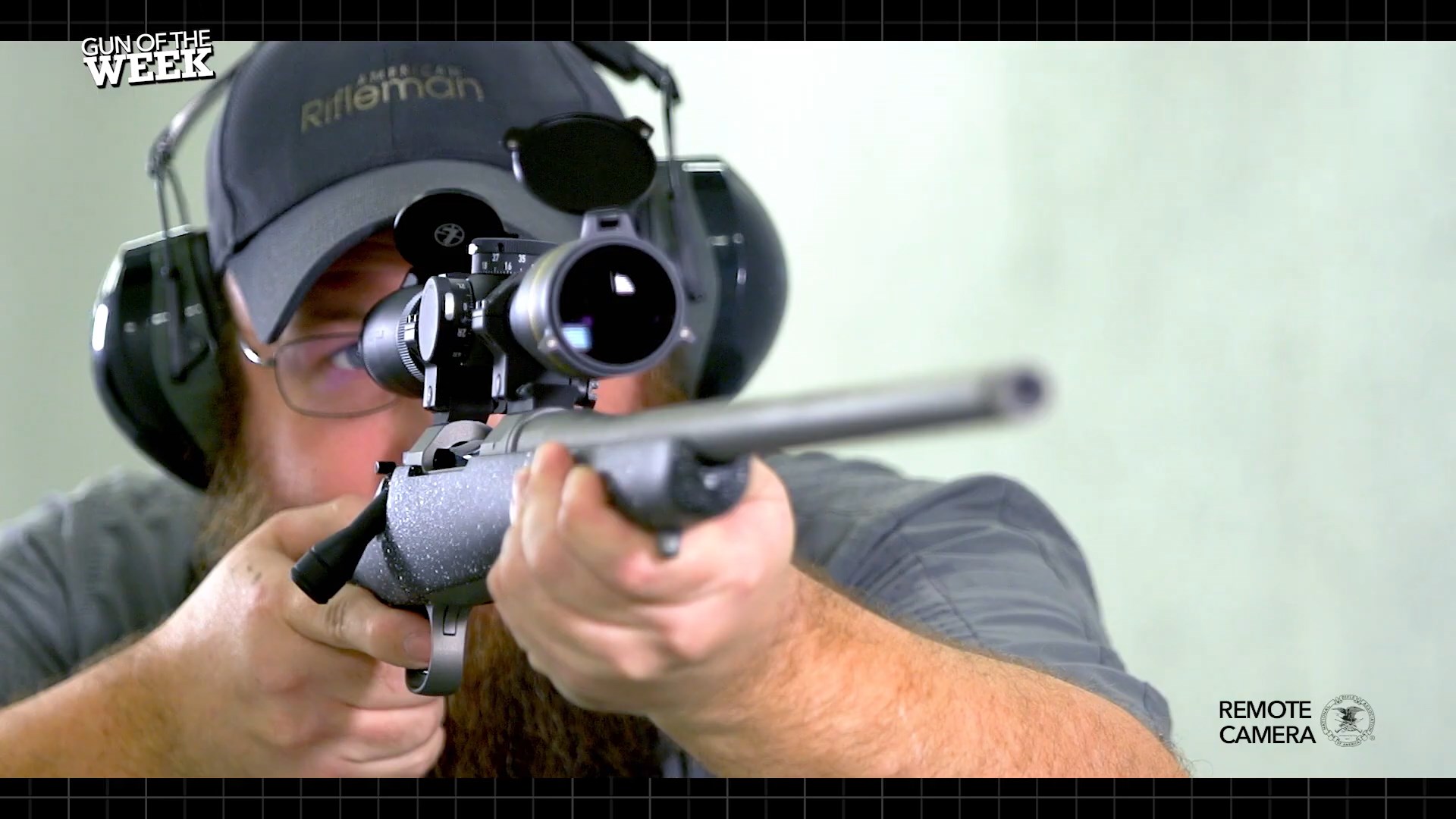 GUN OF THE WEEK remote camera screenshot of man firing bolt-action rifle Nosler m21