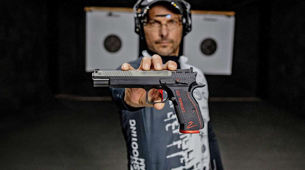 CZ Shadow 2 Target pistol held out away from person man indoors