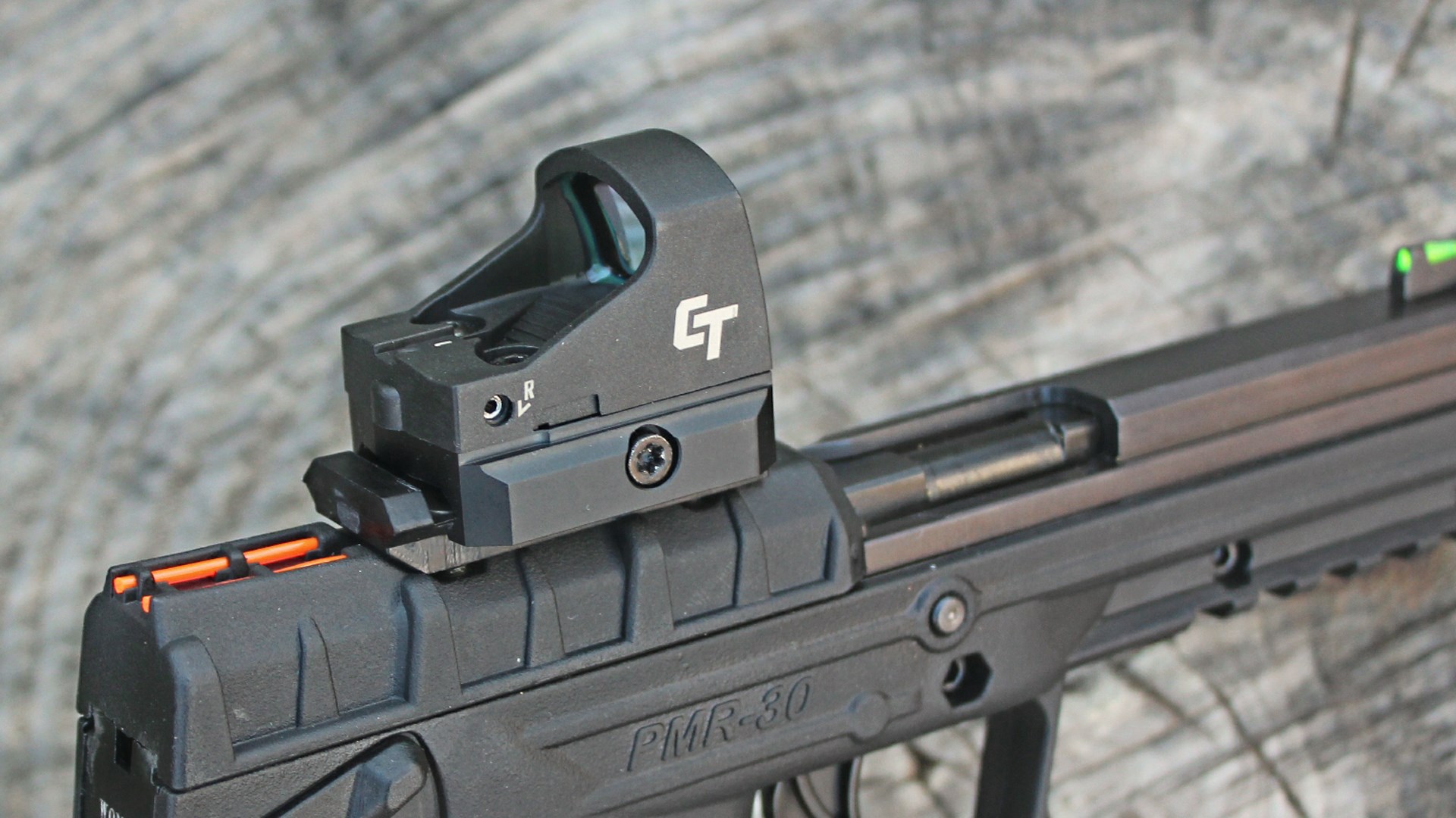 Keltec PMR-30 pistol detail image of slide showing optic red-dot sight mounted to slide