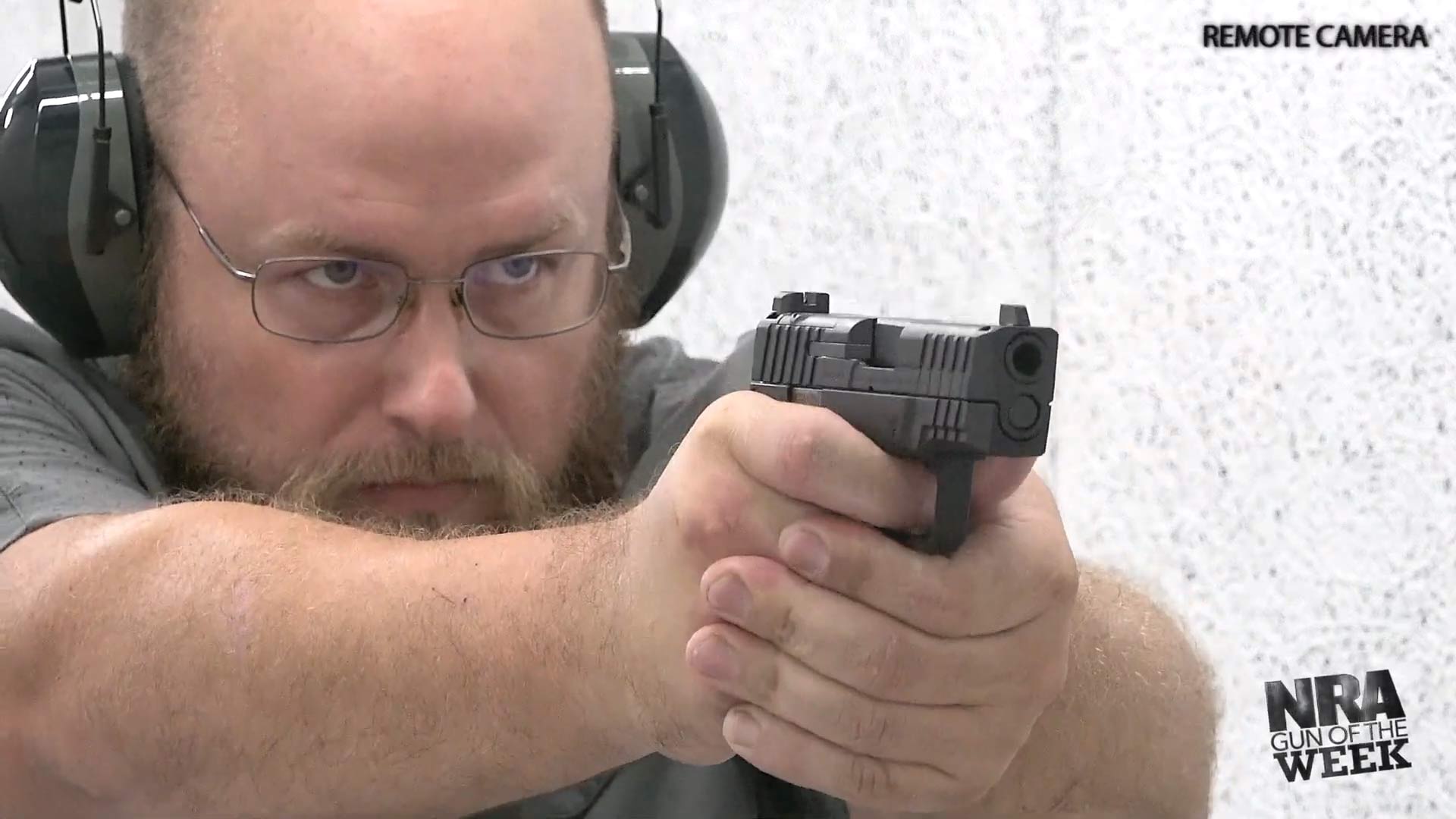 man shooting IWI Masada Slim pistol black gun NRA GUN OF THE WEEK