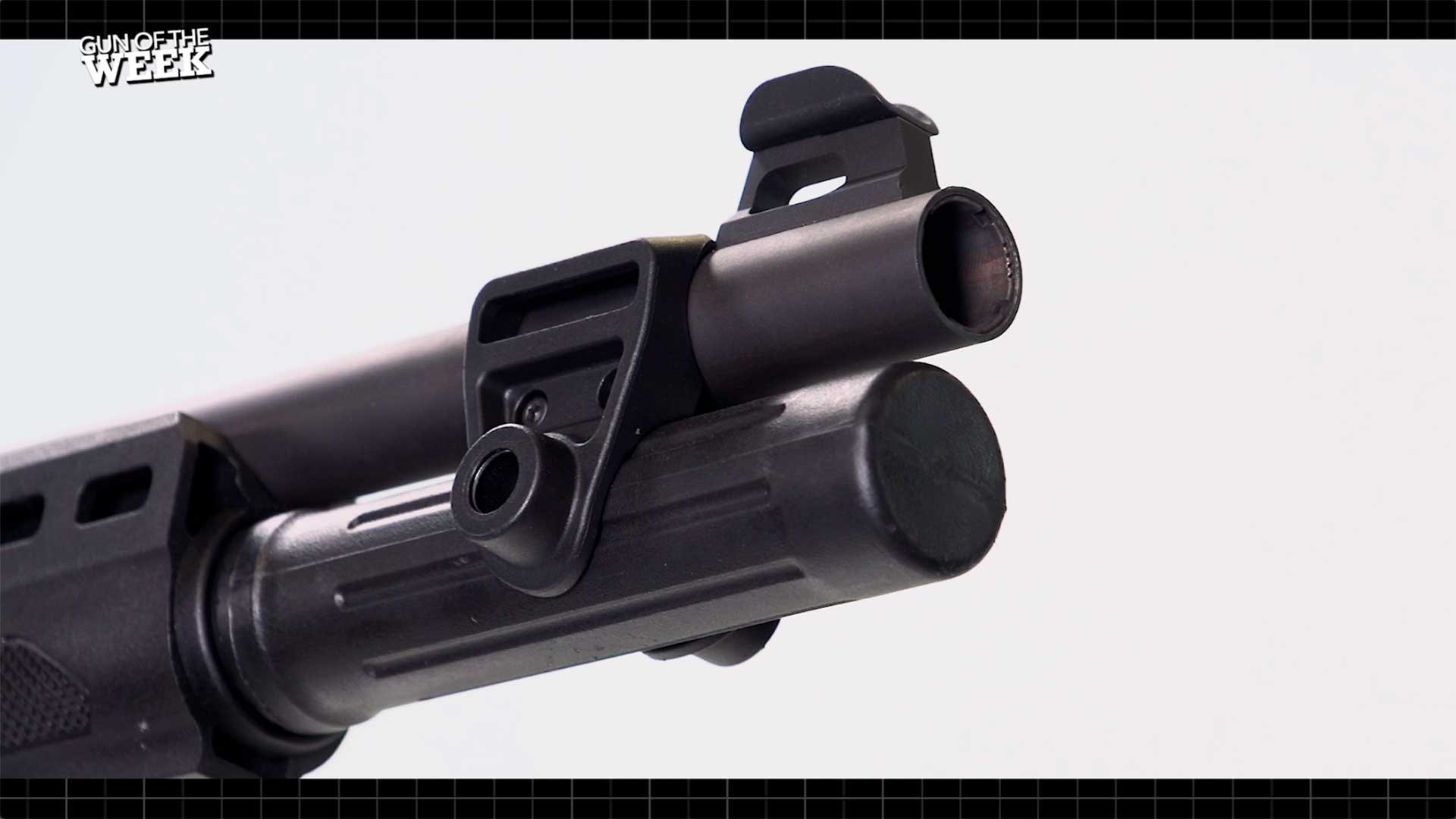 Muzzle end of the Beretta A300 Ultima Patrol, showing the extended magazine tube, threaded barrel and protected wing front sight.