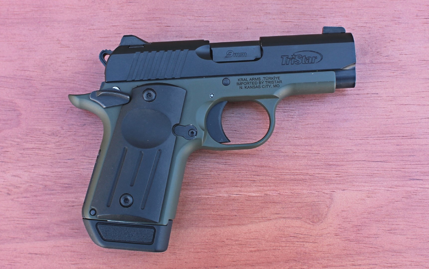 Right side of the TriStar Arms Protege X with an OD green frame and a black slide.