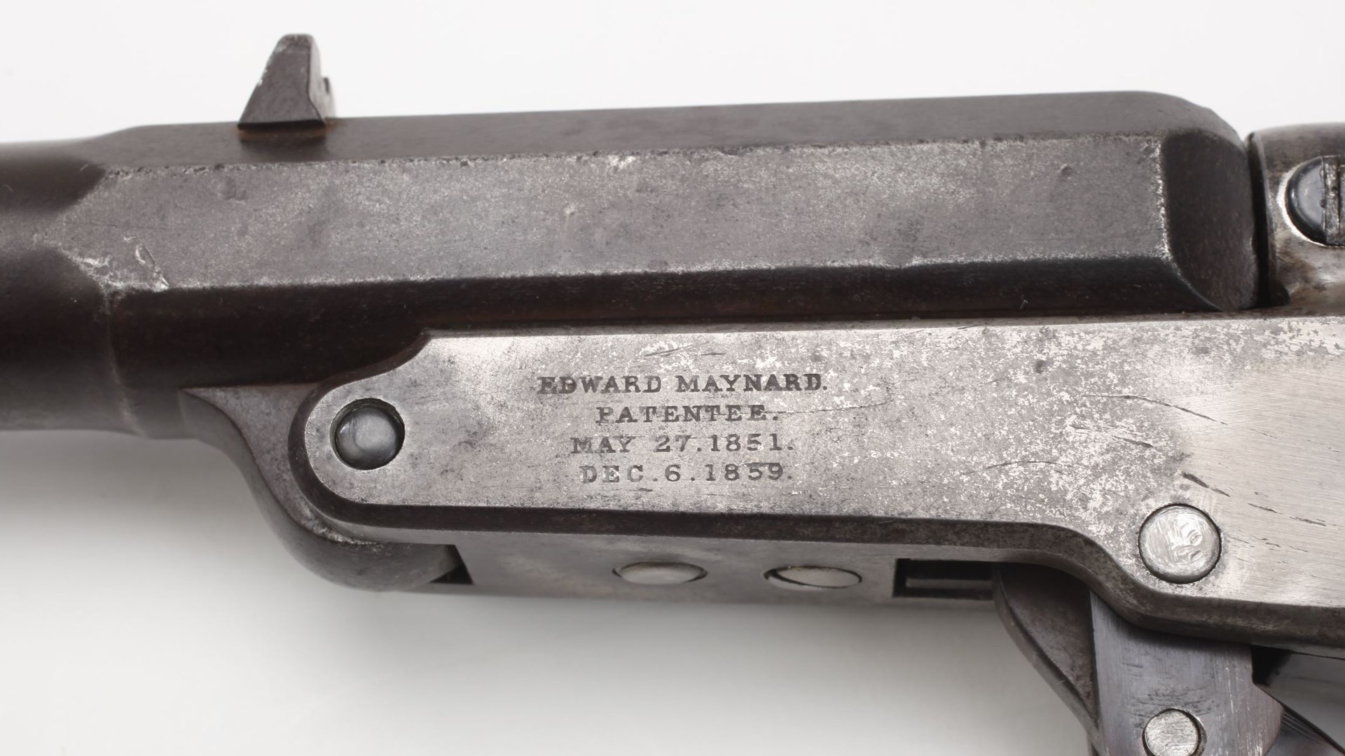 Hinge-action single-shot Maynard carbine receiver left-side closeup view stamping on metal