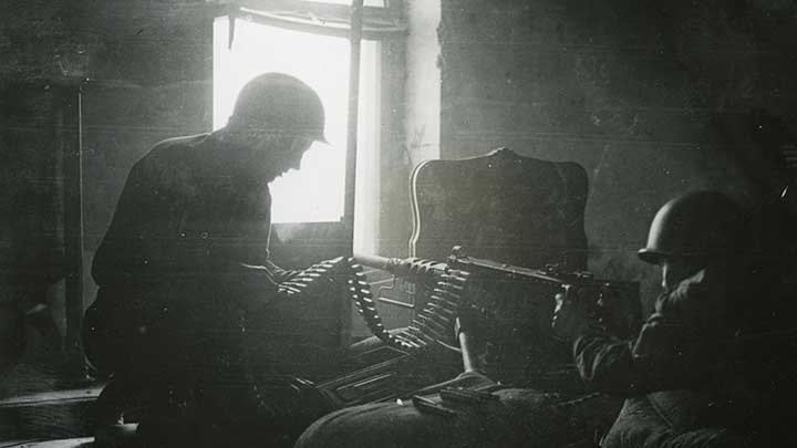 G.I.s use a Browning M2 .50 caliber machine gun to blast German snipers out of Cologne.