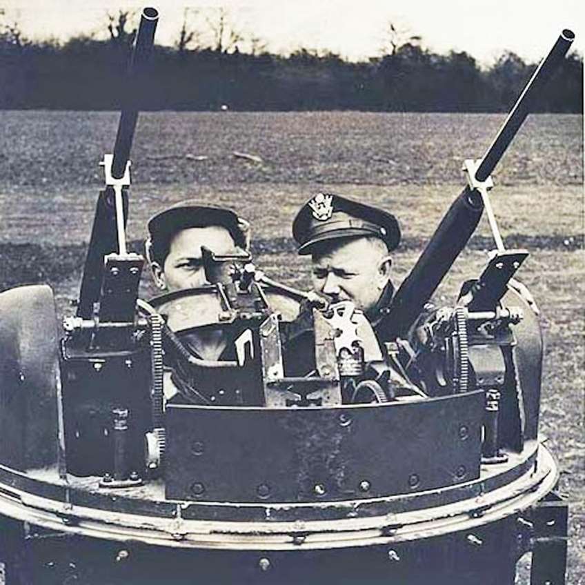 Two Remington Model 11 shotguns mounted into a mock-up twin dorsal turret. This is meant to simulate the dorsal turrets used on many American medium and heavy bombers during World War II, including the B-17 and B-24. The use of 12-ga. shotguns instead of .50-cal AN/M2 machine guns also eliminated the worry of errant rounds in the air during training.