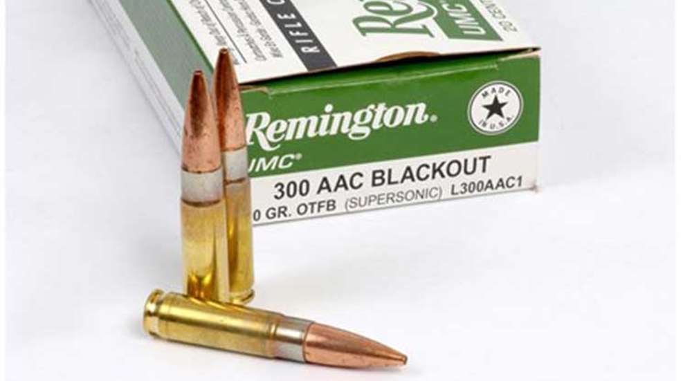 Three .300 Blackout cartridges in front of a Remington ammunition box.