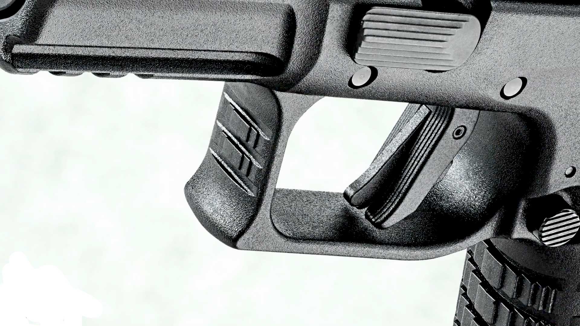 detail view up-close handgun black plastic trigger frame gun