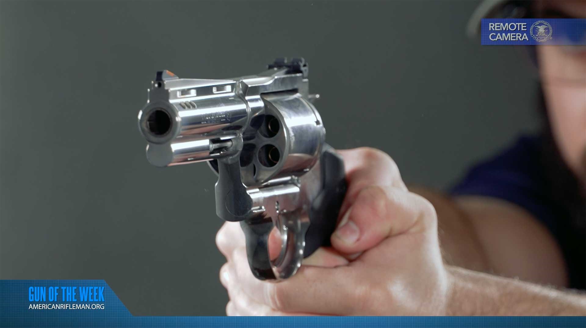 Man aiming the Colt Kodiak revolver on an indoor range.