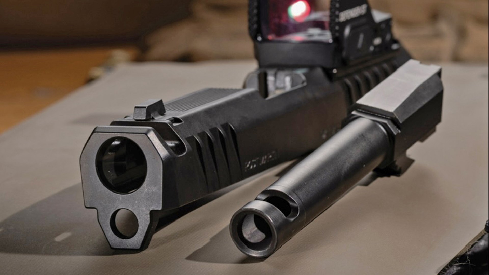 Front view of the Rost Martin RM1C Comped's slide next to its compensated barrel.