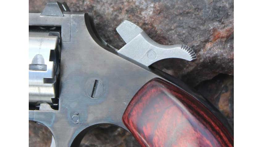A closer look at the side of &quot;The Dude&quot; from the left side with the hammer cocked. Note the case-hardening of the frame.