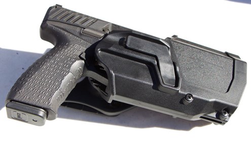 maxim9 silenced suppressed pistol handgun in holster 9 mm