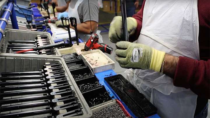 A worker assembling a Heritage revolver at the factory.