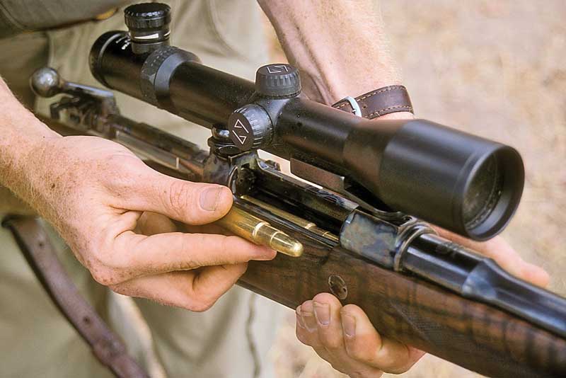 Loading ammunition into bolt-action rifle