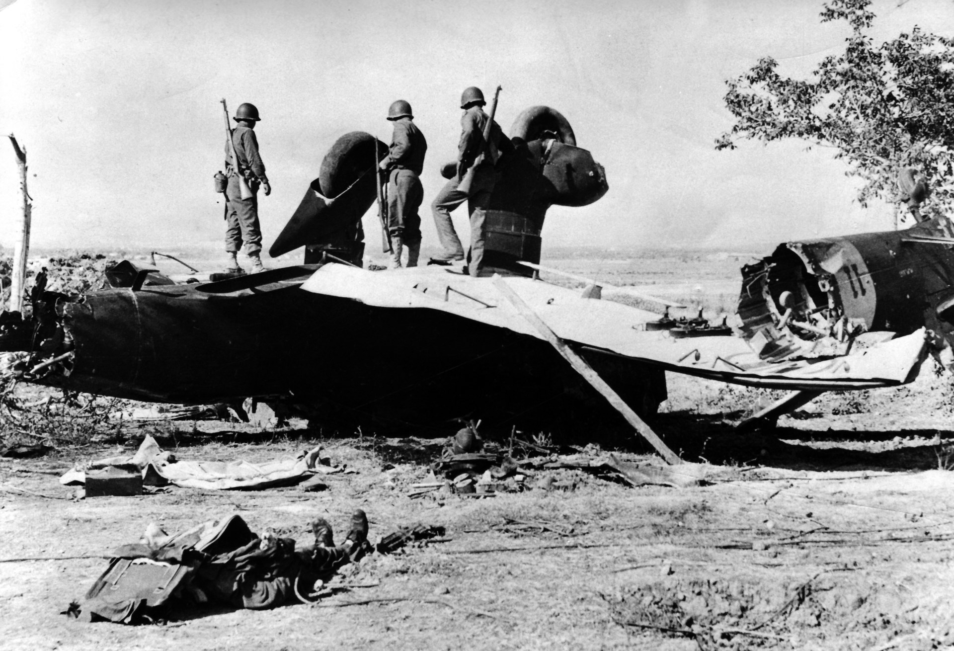 10)	No longer a threat:  US troops examine the wreck of Junkers Ju 87 “Stuka” dive bomber, destroyed on Sicily.  This aircraft was in Italian service, where the Stuka was called “Picchiatello”.  NARA