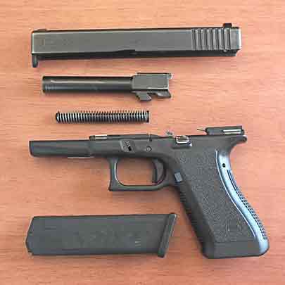 The stock Glock G22 Gen 2 disassembled.