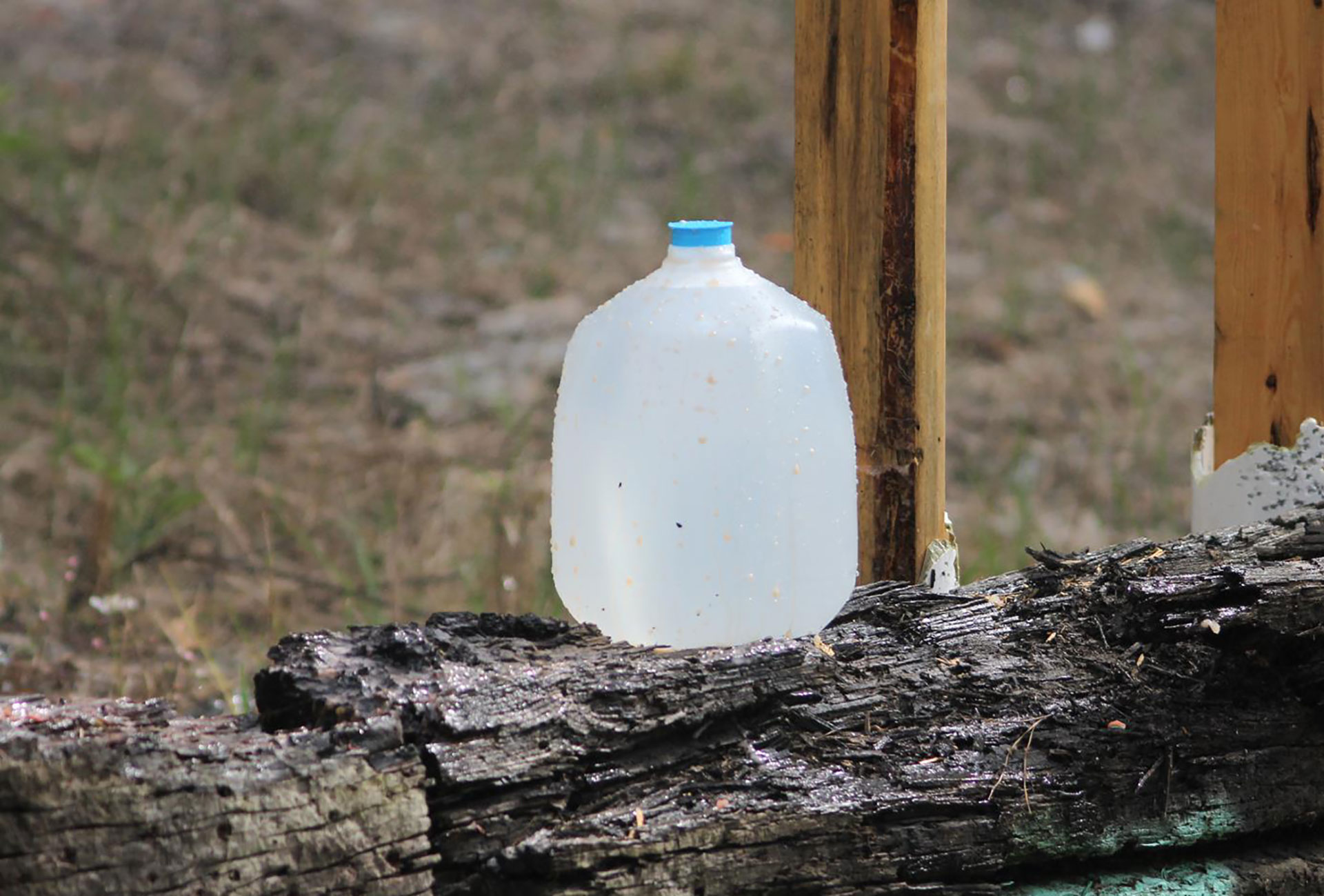 This lone water jug is about to have a close encounter with a solid, fluted .458 SOCOM bullet fired from a carbine at close range.