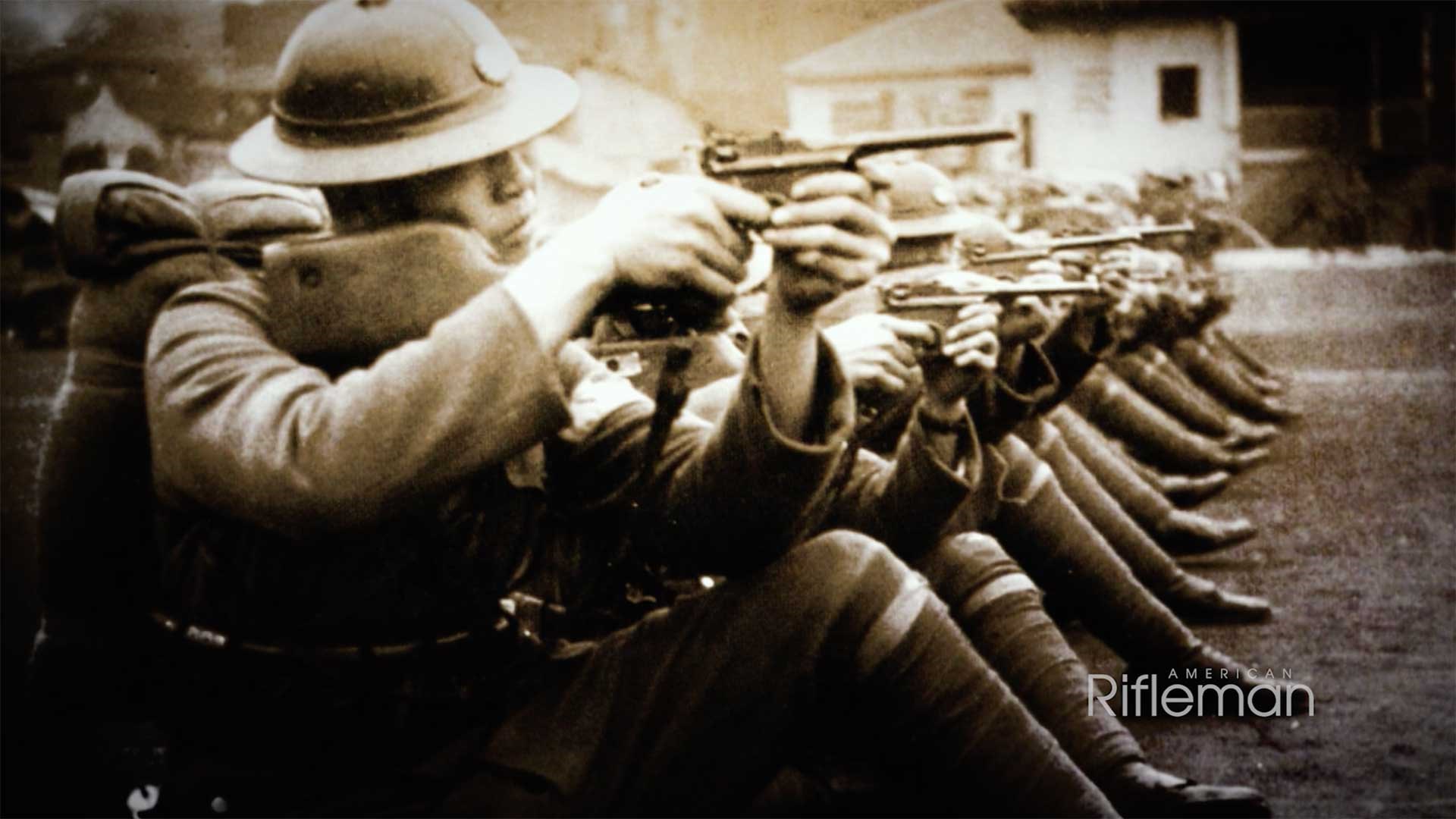 Chinese troops aiming C96 Broomhandle Mauser pistols equipped with shoulder stocks.
