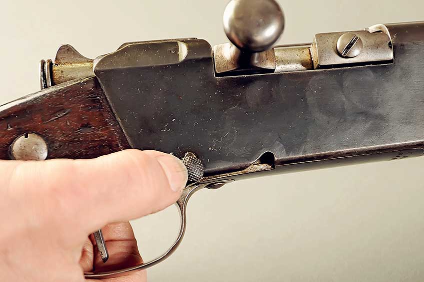 A cut-off button on the right, lower rear of the action affects the engagement of the lifter allowing the rifle to be fired either single shot with ammunition in reserve in the magazine or as a repeater.