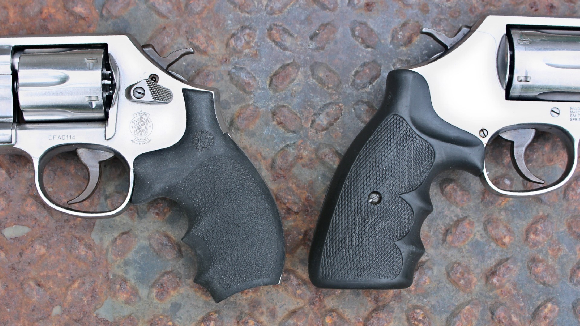 Smith & Wesson stainless steel model 64 648 side-by-side comparison of stocks grips black rubber stainless steel guns shown on rusted treadplate