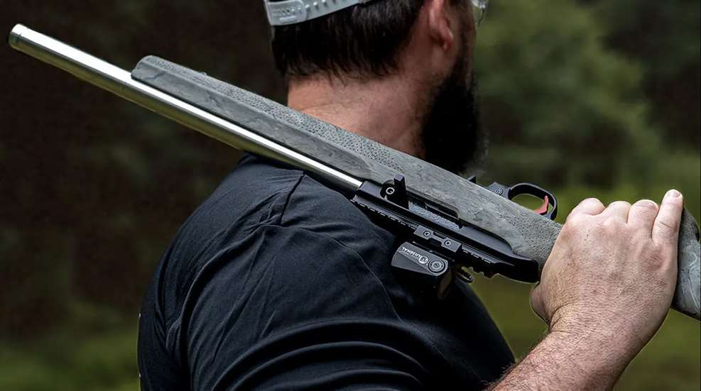Bear Creek BC 200 semi-automatic rifle slung over man's shoulder outdoors