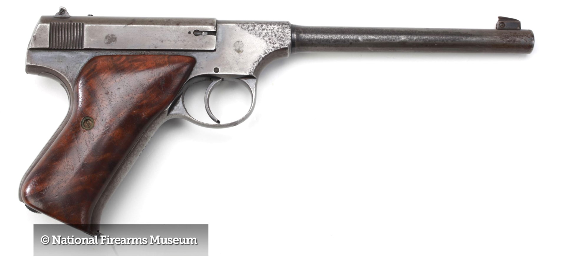Colt Woodsman 22 caliber rimfire pistol handgun right-side view on white nra museum stamp