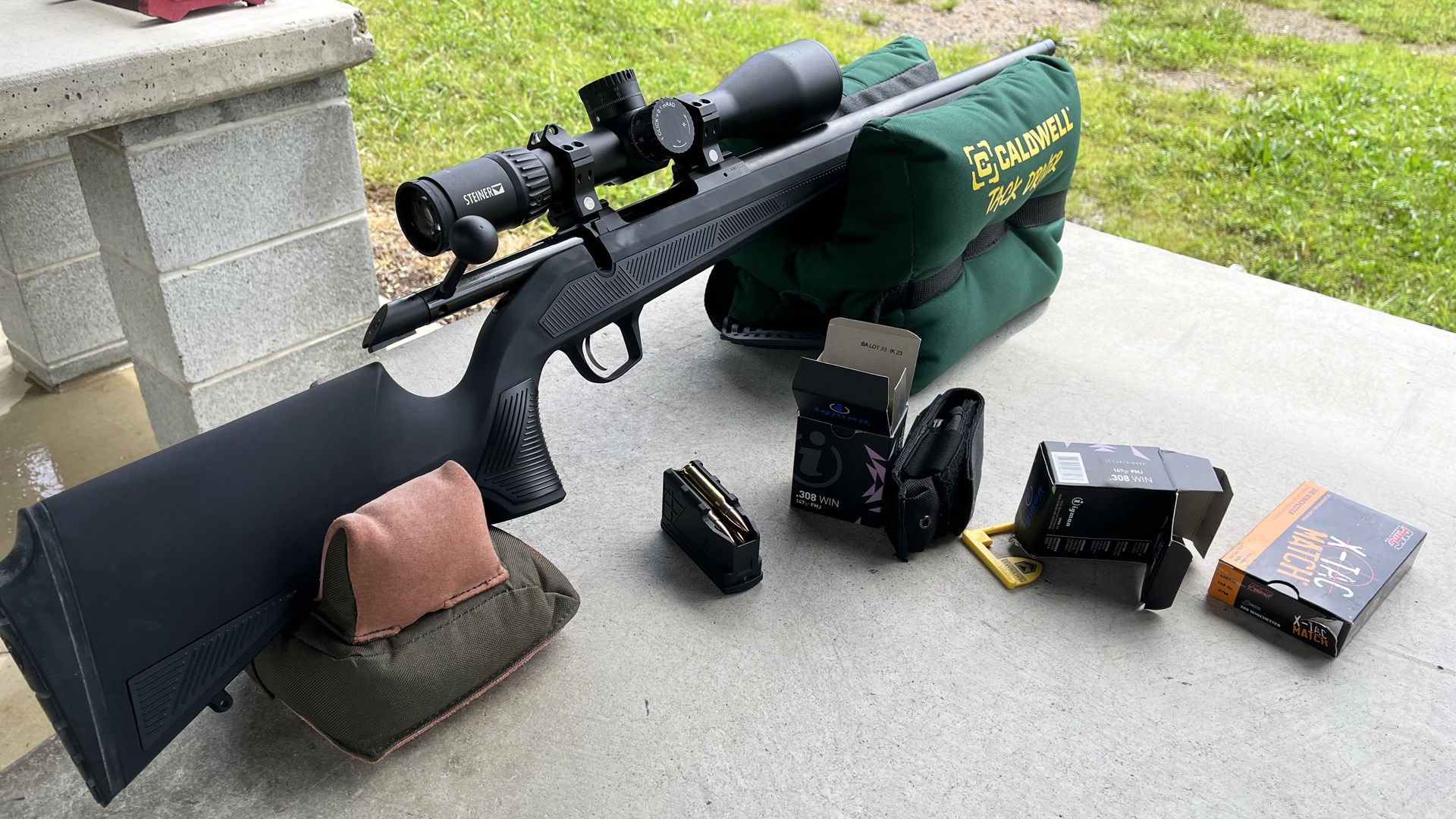 CZ 600 alpha on shooting bench with gear ammo