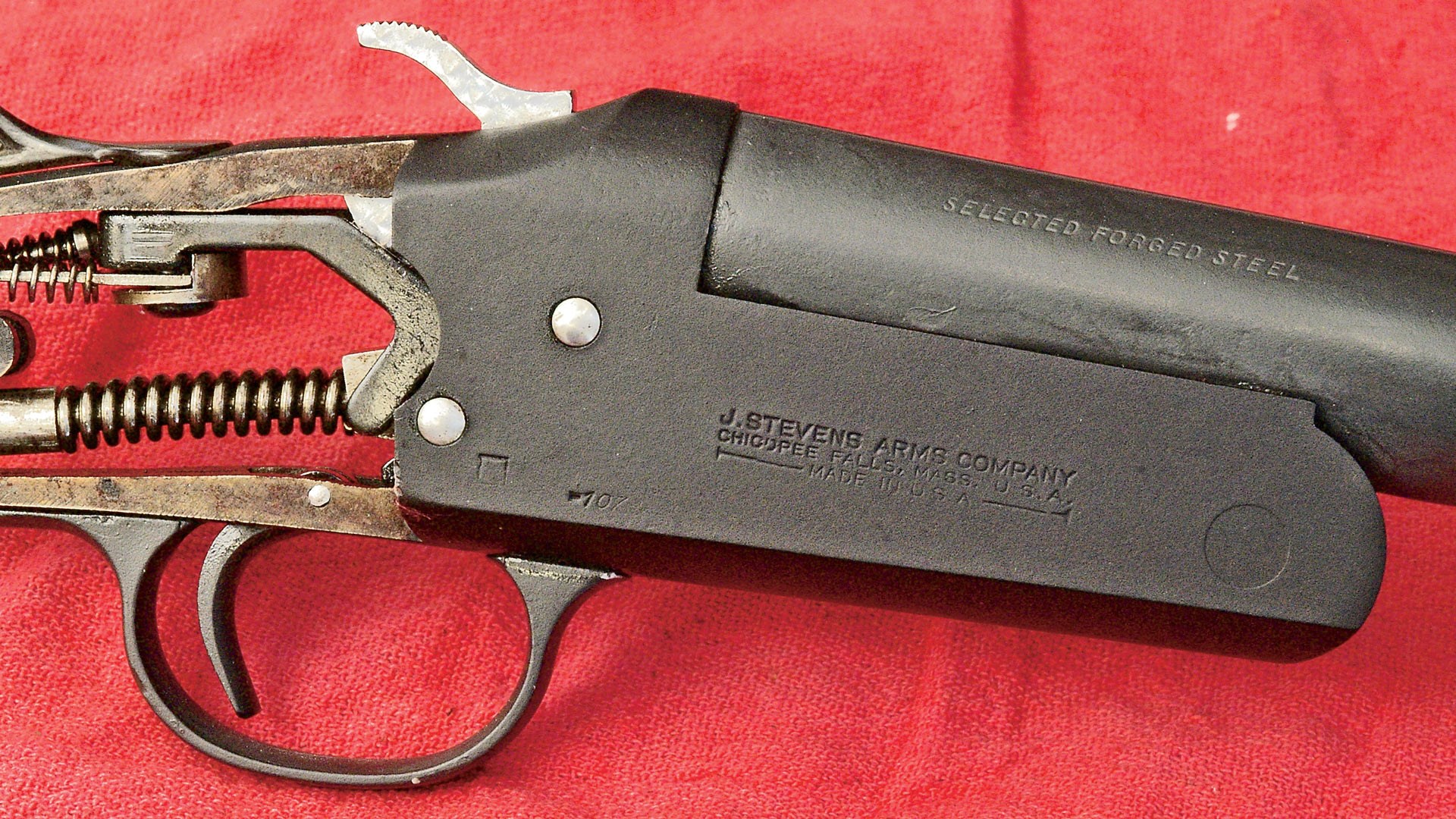 black coating after effect applied to firearm shotgun receiver