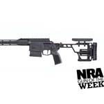 left side black bolt-action rifle plastic metal silver barrel text on image noting "NRA GUN OF THE WEEK"