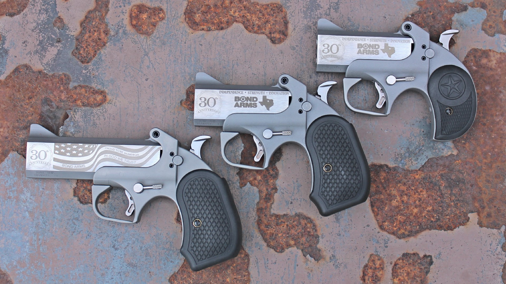 Three Bond Arms 30th Anniversary derringers shown side by side.