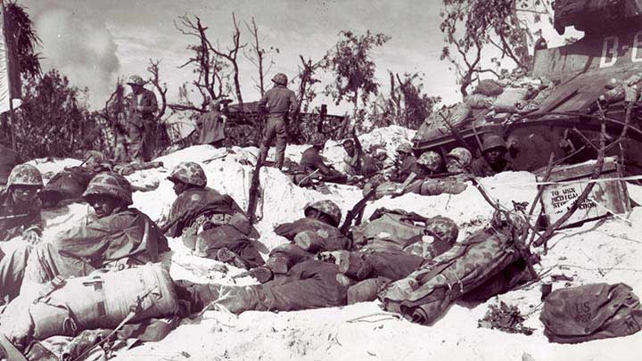 Marines of the 16th Marine Field Depot on Peleliu’s &quot;White Beach&quot; after just having landed on Sept. 15, 1944. They are armed with M1903A3 rifles.  (National Archives and Records Administration – 532535/127-N-95279).