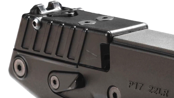 Close-up right-side view of rear portion of P17 slide showing serrations, safety and rear sight.