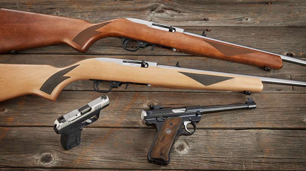 75th anniversary Ruger guns shown arranged on wood boards 10/22 carbine lcp max standard model pistol