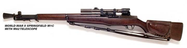 Left-side view on white background of World War II Springfield M1C with M82 telescopic sight and leather sling.