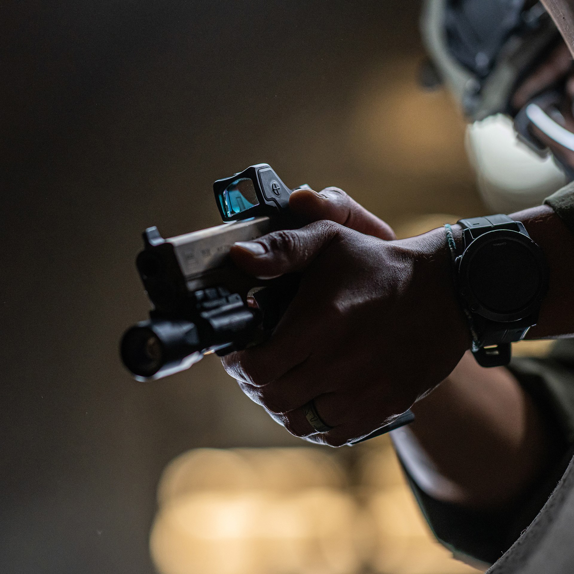 Trijicon RMR HD red-dot optic mrd on gun forward-facing view swat operator flashlight gun