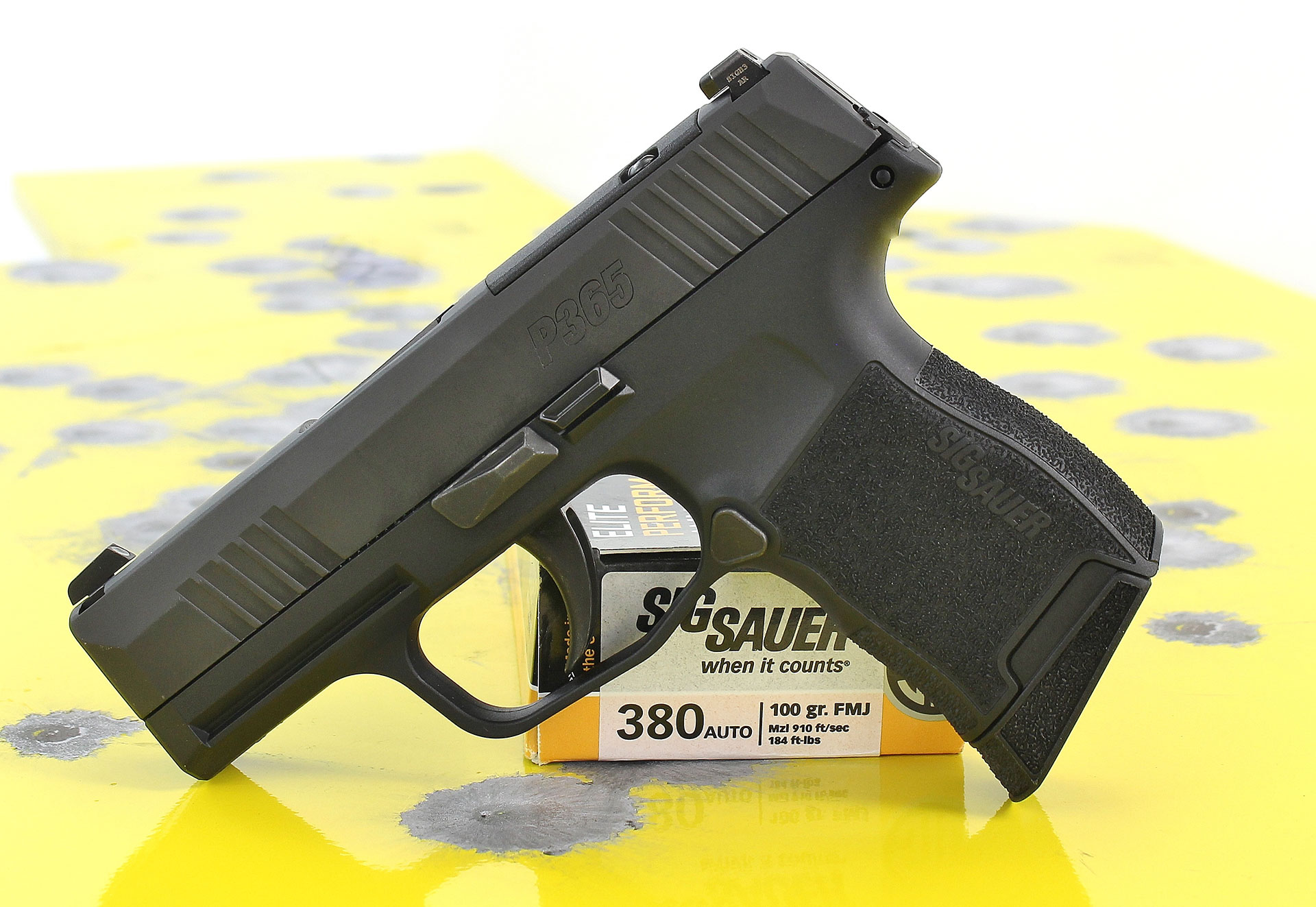 SIG Sauer P365-380 chambered in .380 ACP Black, steel and polymer construction, with a yellow background.