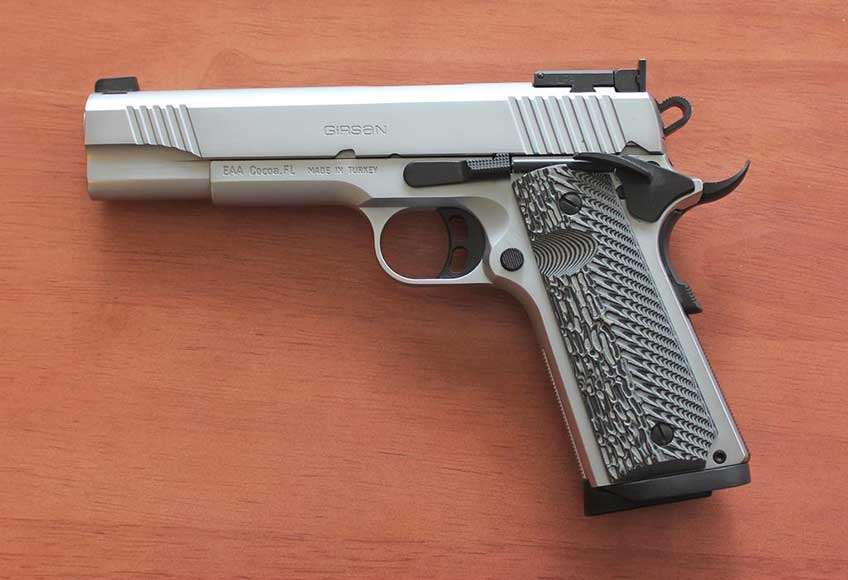 left side of girsan mc1911 match elite stainless steel semi-automatic pistol on wood table