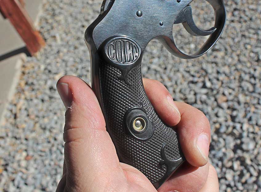 colt police positive revovler grip frame in hands outdoors